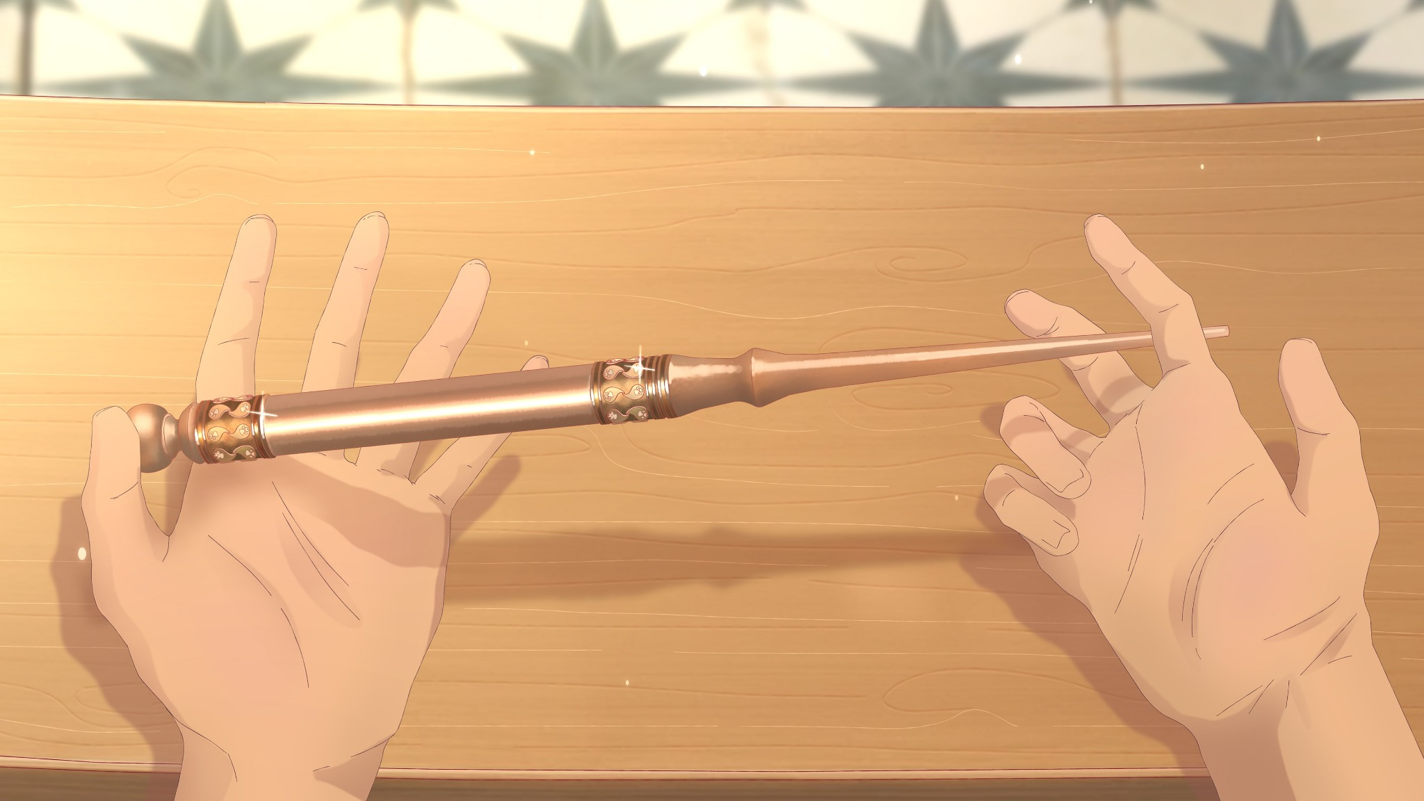 A new wand resting across the human student’s hands
